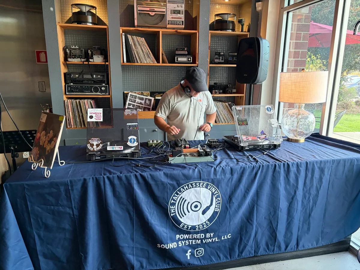 Turntables and a mixer set up on the Tallahassee Vinyl Club table