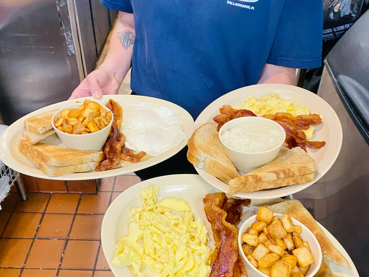 Breakfast plates — eggs, bacon, home fries and toast